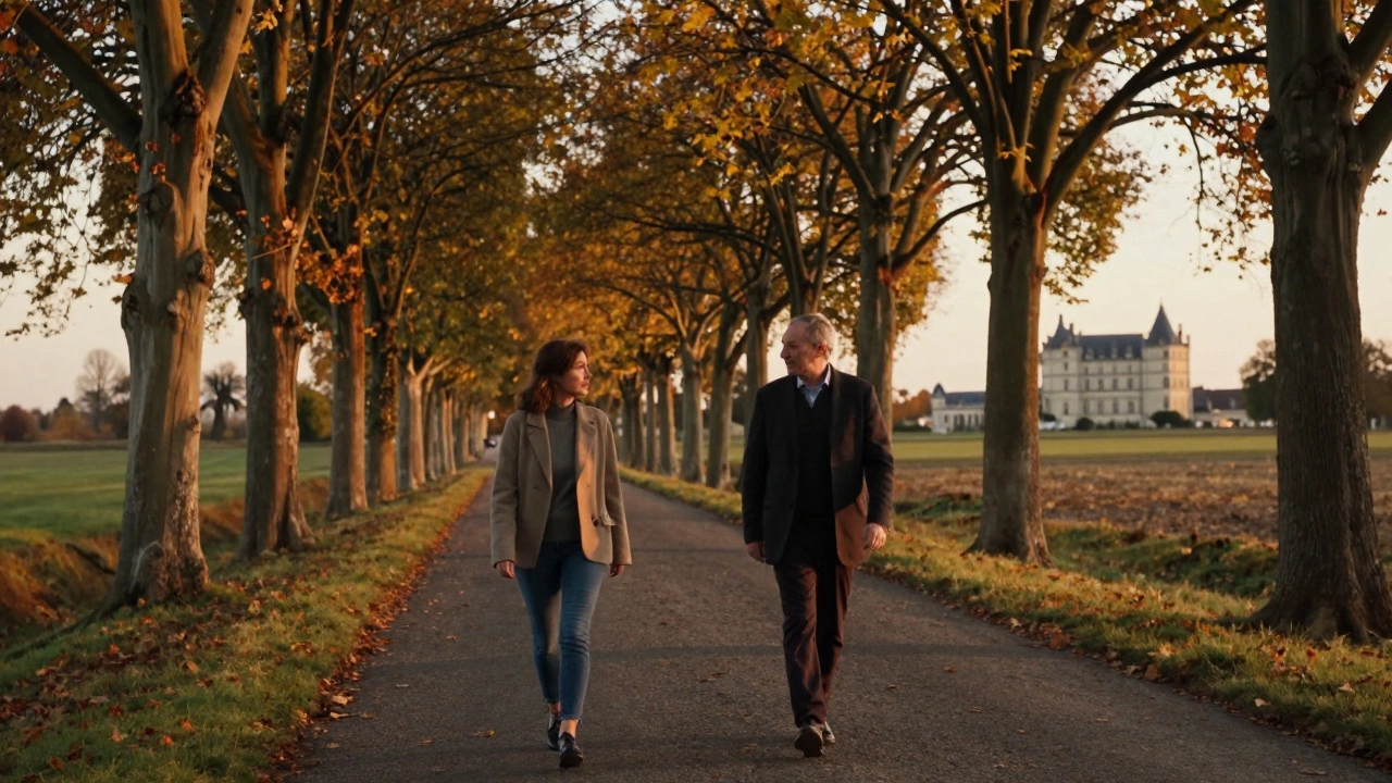 A woman and man walk peacefully along a tree-lined country road near Reims at sunset.